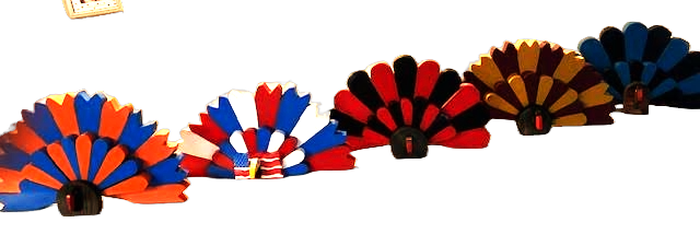 Lineup of handmade wood Team Turkey decor in multiple team color options